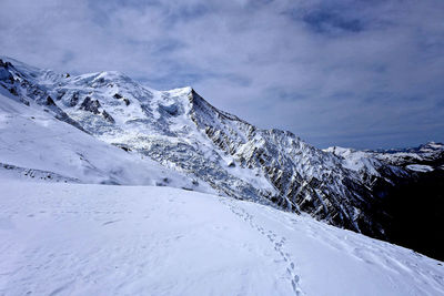 Scenic view of snowcapped mountains against sky