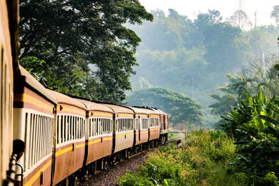 Train on railroad track against sky