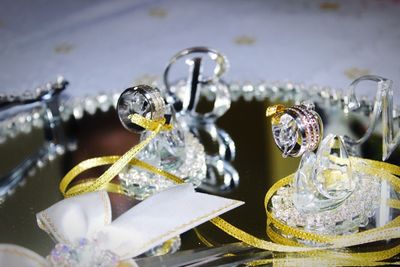 Close-up of rings in figurine on table