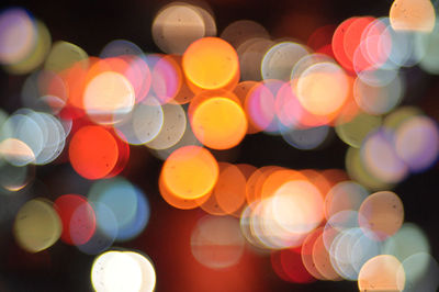 Defocused image of illuminated lights at night