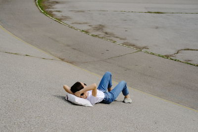 High angle view of woman lying down on floor