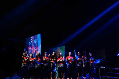 Crowd at music concert at night