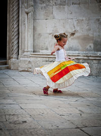 Full length of a girl with umbrella