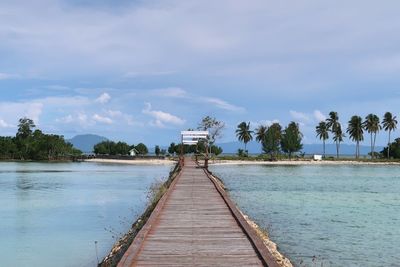 Pier over sea against sky