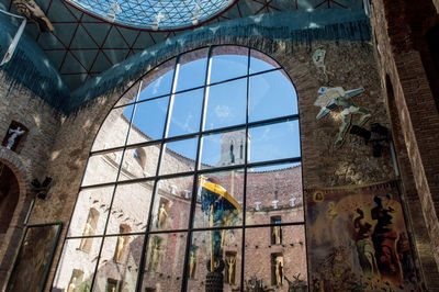 Low angle view of glass window in building