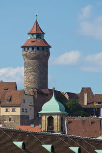 Old building in city against sky