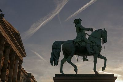 Low angle view of statue against cloudy sky