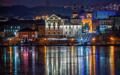 Panoramic view of ternopil pond and castle in ternopol, ukraine, on a winter night