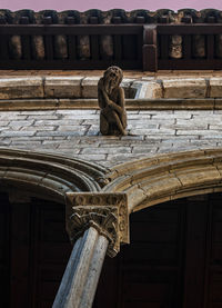 Low angle view of statue against temple