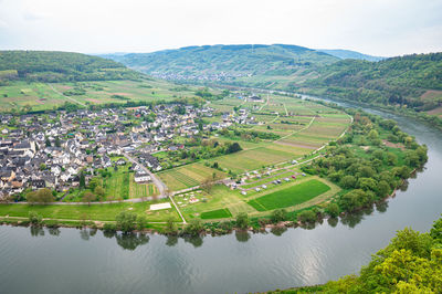 View of the village of pünderich, located in one of the many bends of the river moselle, germany.