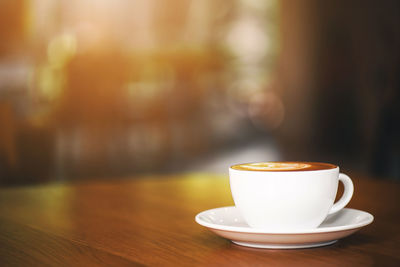 Close-up of coffee cup on table