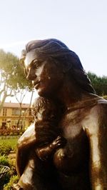 Close-up of statue against clear sky in park