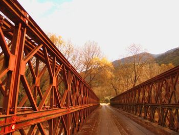 Bridge over road against sky