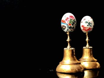 Close up of electric lamp against black background