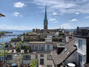 Buildings in city against sky