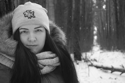 Portrait of young woman in snow