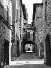 Narrow alley amidst buildings in city