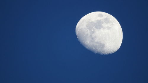 Low angle view of moon against sky at night