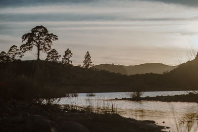 Scenic view of lake against sky during sunset