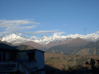 Scenic view of snowcapped mountains against sky