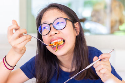 Portrait of woman eating ice cream