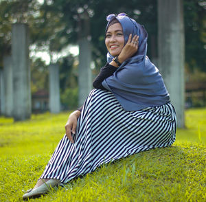 Woman sitting on field