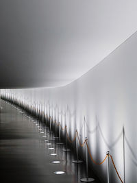 Row of railing against sky