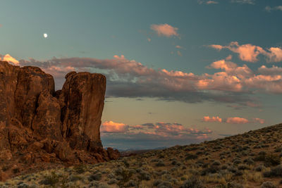 Scenic view of rocky mountains against sky during sunset