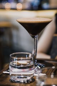 Close-up of coffe in glass on table