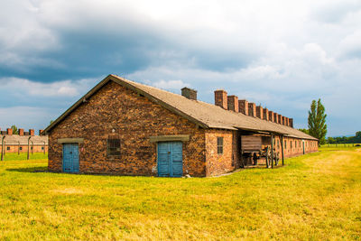 House on field against sky