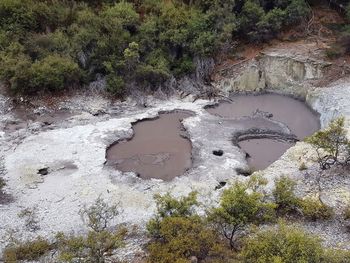 High angle view of water flowing through rocks