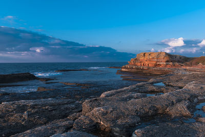 Scenic view of sea against cloudy sky