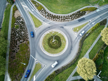 High angle view of vehicles on road amidst trees