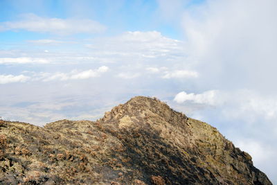 Low angle view of rock formations against sky