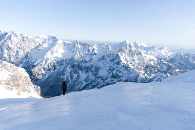 Scenic view of snowcapped mountains against clear sky