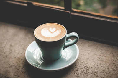 Close-up of coffee cup on table