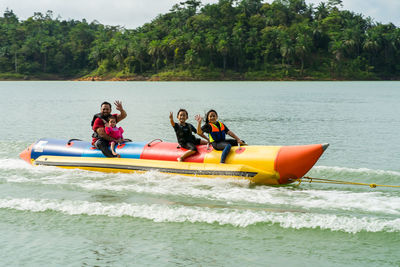 People in boat on sea