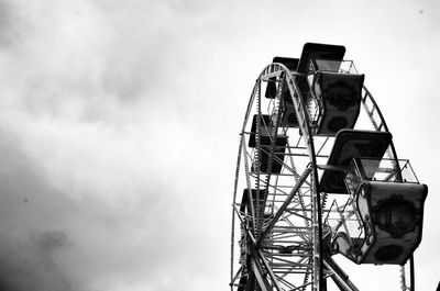 Low angle view of ferris wheel against sky