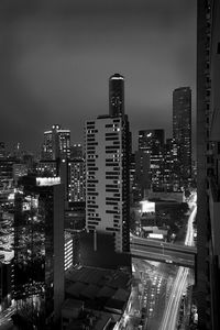 High angle view of city lit up at night
