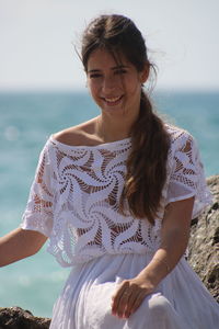 Portrait of a smiling young woman on beach
