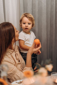 Portrait of sisters playing at home