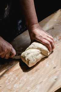 High angle view of man preparing food on table