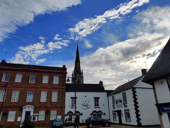 Low angle view of buildings against sky in city