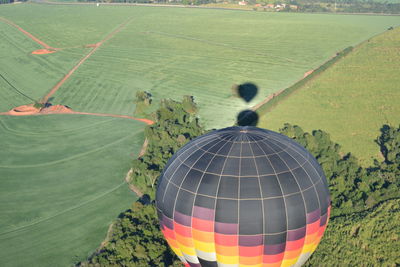 Rear view of hot air balloons on landscape