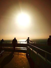 Silhouette of people at sunset