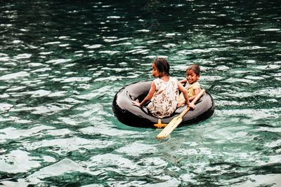 High angle view of couple kissing in water