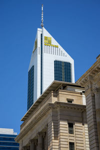 Low angle view of building against clear blue sky