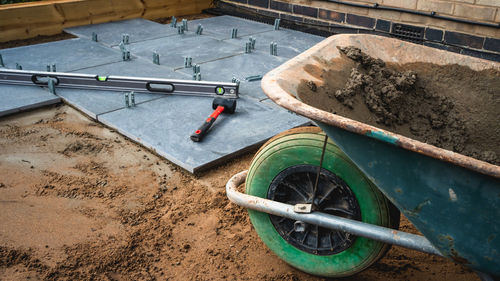 Patio being laid with tools and wheelbarrow