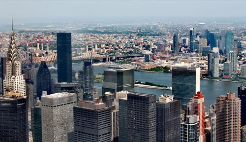 Aerial view of buildings, the chrysler tower and the hudson river in nyc. 