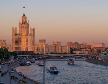 View of buildings in city at sunset